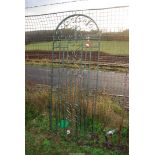 A wrought iron arched gate, 28" wide x 6ft high.