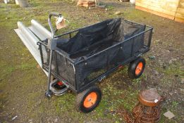 A Von Haus garden trolley with a liner on pneumatic tyres, 4' x 2'.