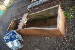 A double water trough, 8' long x 25" wide x 19" high.