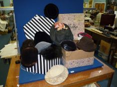 A Bobby's vintage hat box containing Bobby's ladies hats 1930's-50's, mostly in velvet or felt,