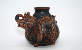 A heavy ceramic oriental Vessel in the form of a man riding an elephant (the gent's head needs