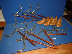 Two pairs of ladies shoe trees, size 7 1/2 and eight wood and brass Barrister wig and gown hangers,