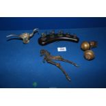 A brass betel nut cutter Chopping tool in the form of horse, two brass clock finials,