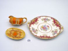 A Shelley orange ground Sauce boat and saucer and a floral decorated Shelley bread and butter Plate.