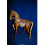 A carved wooden horse 20'' high x 16 1/2'' long