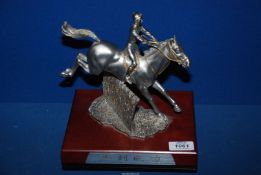 A Royal Selangor pewter award of a horse jumping the sticks , made for APD Customer Services Award,