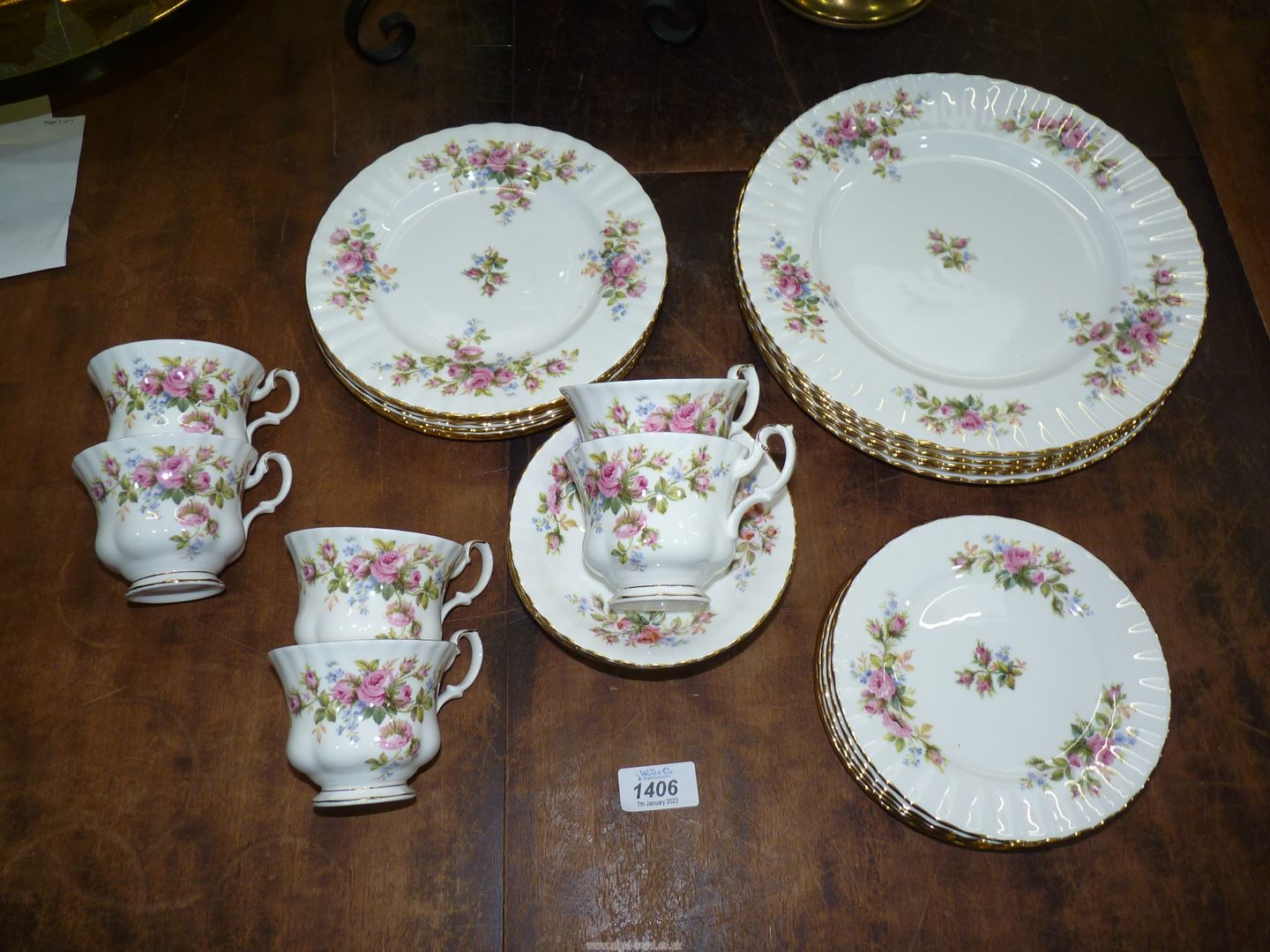 A Royal Albert ''Moss Rose'' teaset comprising six cups and saucers, tea plates, dinner plates, etc.