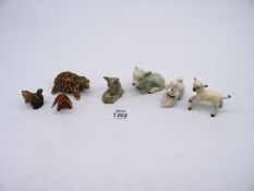 A small quantity of figures including Wade tortoise, a Beswick lamb, a poodle, rabbit and lamb, etc.