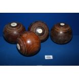 Four Taylors Rolph Penshurst wooden lawn bowls, some splits.