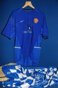 An Everton Football Club flag and a Manchester United away shirt for the 2002/3 season,