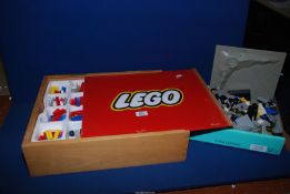 A vintage Lego Box with sliding lid and two layers of contents