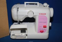 A small Singer electric featherweight sewing machine