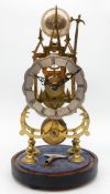 An appealing Victorian brass skeleton Clock having a cable fusee single-train movement performing a
