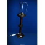 A tall bronze effect Arts and Craft Candle Holder converted to a table lamp with floriate shaped