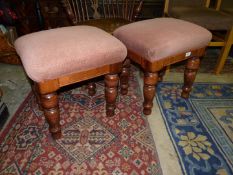 A pair of rectangular Stools having turned legs and rust/beige upholstered over stuffed seats,