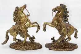 A pair of heavy Brass 'Horses of Marley', marked Coustou to base, with leather reins,