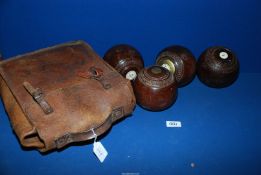 Four Taylors-Rolph Penshurst wooden lawn Bowls, in leather case.