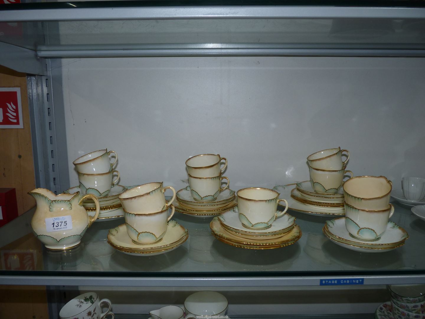 A quantity of George Jones & Sons Crescent teaware in cream with pale blue and gilt edge scallop