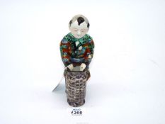 A Japanese porcelain figure of a Gent with a basket, 7 1/2" tall.