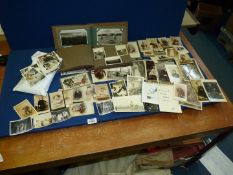 A collection of Carte de Visite, old photographs and postcards.