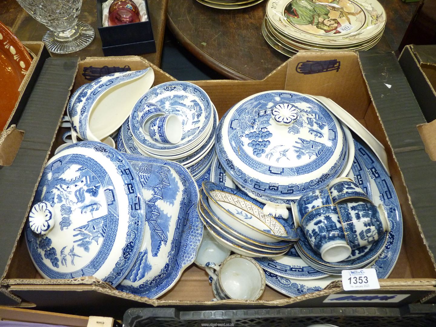 A large quantity of blue and white china including Wedgwood 'Willow' dinner ware, tureen,