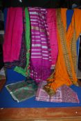 A collection of vintage Sari lengths in cotton and silk.