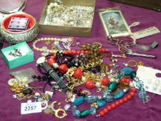 A box of costume jewellery including beaded necklaces, diamante bracelets, various studs etc.