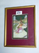A framed and mounted Indian scene depicting a female figure sat under a tree,