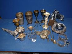 A quantity of white metals including a pheasant, goblets, cocktail shaker, toast rack, etc.