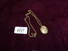 An unmarked Gold ? mourning locket and anchor chain.