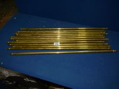 A quantity of brass stair rods.