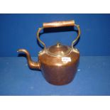 A copper Kettle with brass finial.