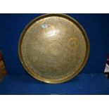 A large brass Benares Tray with scenes of figures and animals, 23 1/2'' diameter.