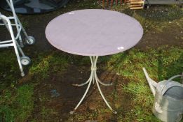 A small metal garden table, 27" diameter x 27 1/2" high.