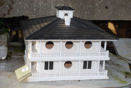 A 'Bird Mansion' of Colonial design by Gardener's Eden.