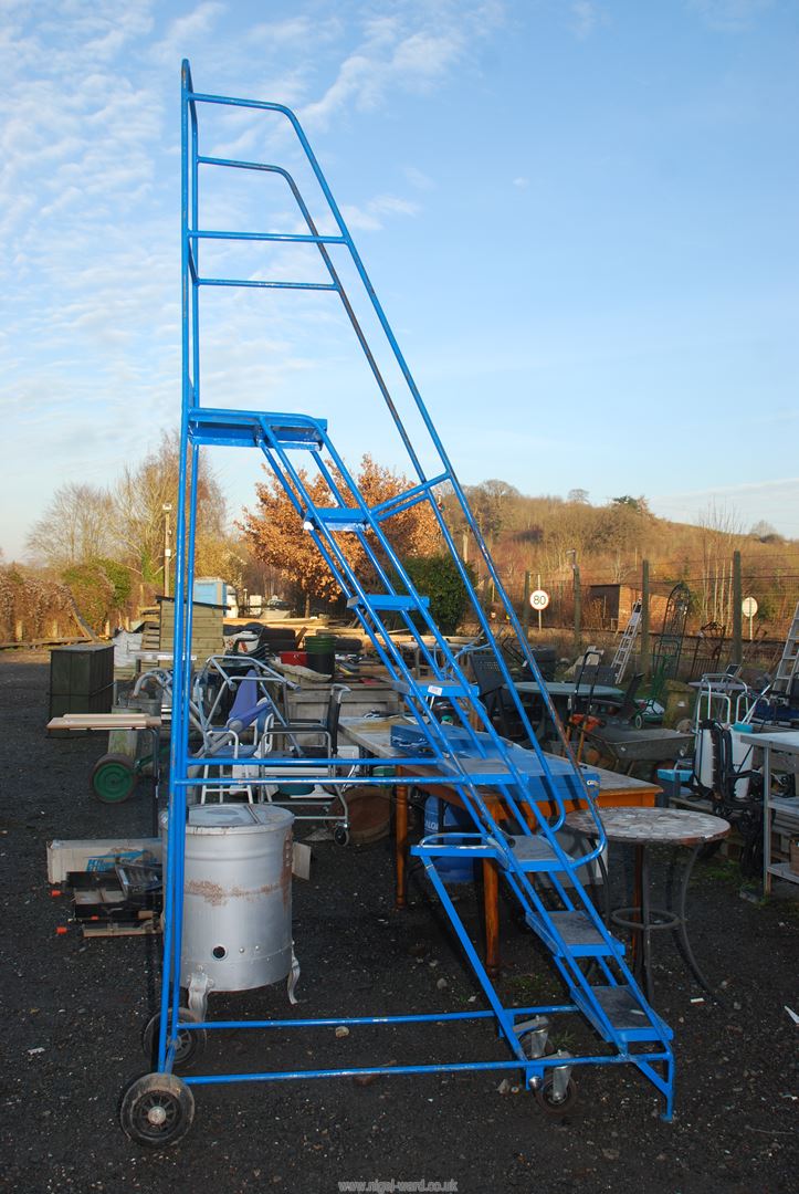 Industrial stepladder 80'' to top step, with fold up parking foot.