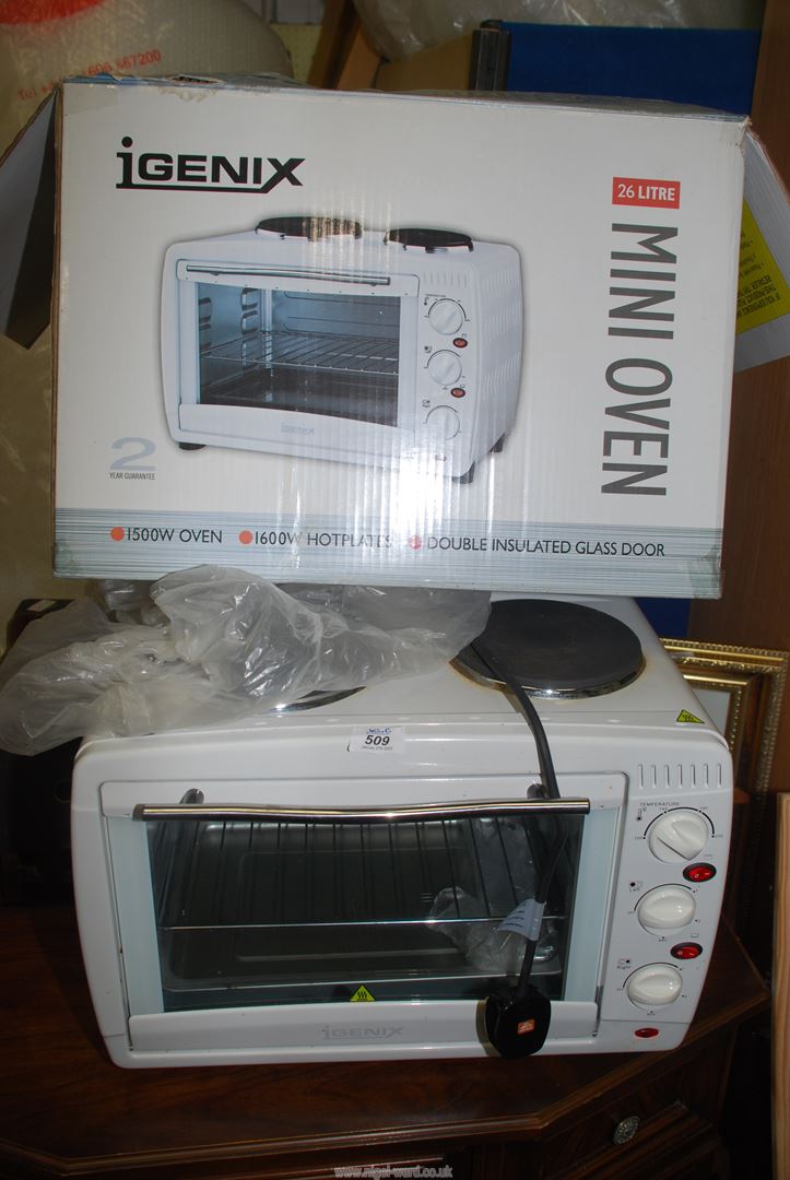 An Igenix mini oven with double hot plate in original box.