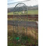 An arched wrought iron gate, 28" wide 6' high.