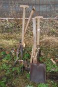 A shovel, axe, sledgehammer and forks.