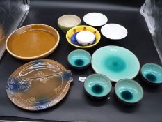A small quantity of pottery bowls and serving plates.