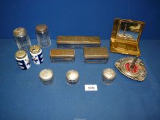 A quantity of metal dressing table sets, one lid silver, gilt metal compact, etc.