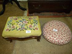 Two wooden footstools, one tapestry and the other circular having three button feet.