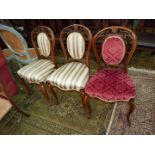Three elegant Walnut framed side Chairs standing on canted cabriole front legs,