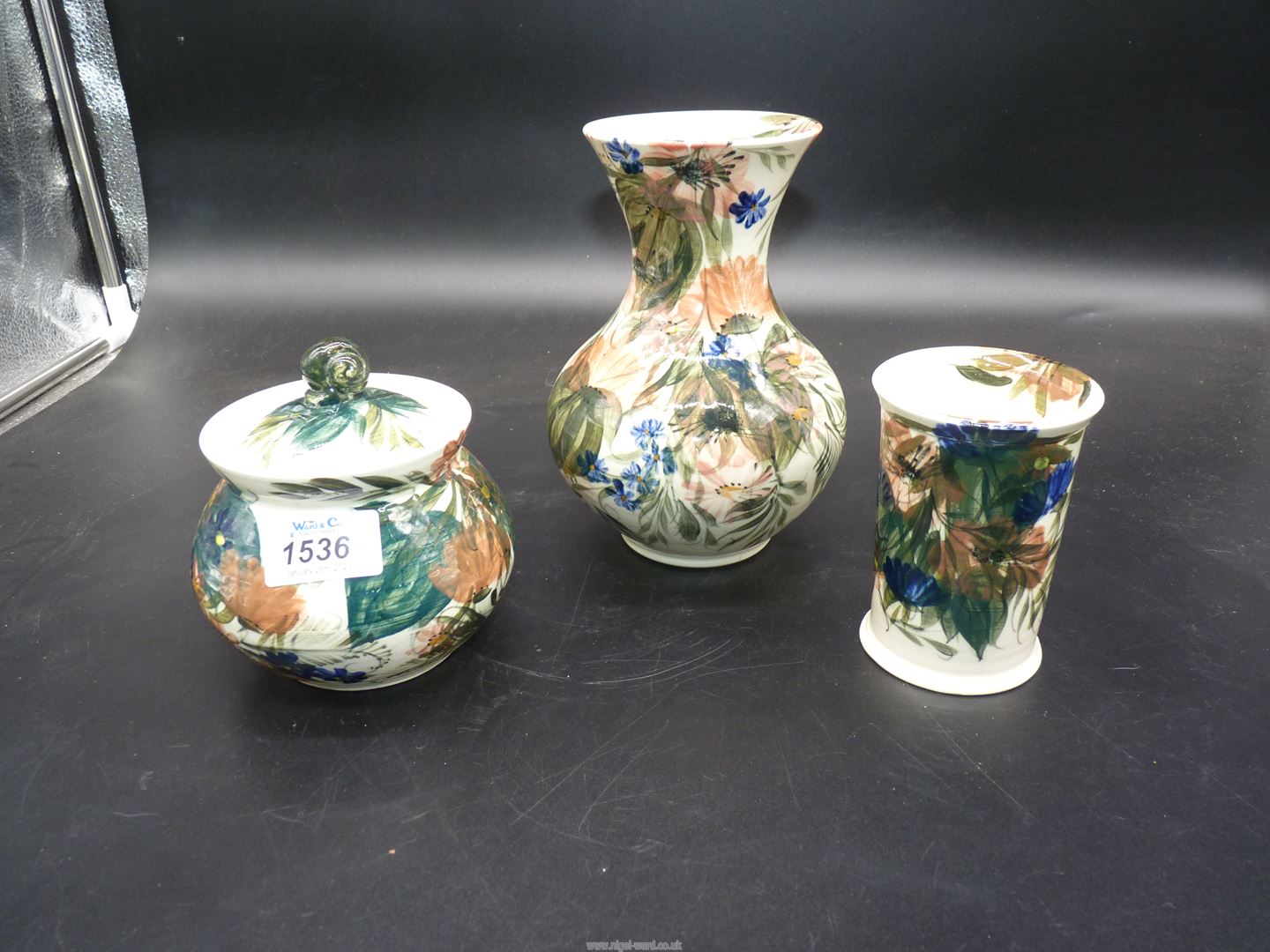 Three pieces of Gwili pottery by J. Davies including two vases and lidded pot.