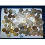 A tin of English and foreign silver coins including coins from Monte Carlo,