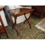 A dark Mahogany finished rectangular Occasional Table standing on 'X' shaped legs,