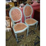 A pair of shabby chic side Chairs having caned oval backs and shaped seats and standing on turned