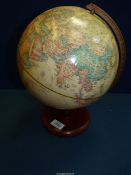 A World classic globe on a wooden stand, 9'' diameter.