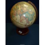 A World classic globe on a wooden stand, 9'' diameter.