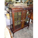 A Mahogany China Display Cabinet having a pair of opposing four pane glazed doors,